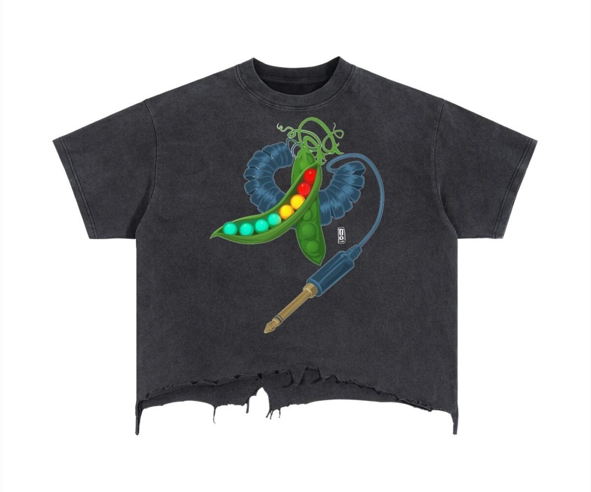 "Peas" front view black colored boxy fit vintage wash t-shirt with distressed hem. Pea Pod and headphone jack design graphic.