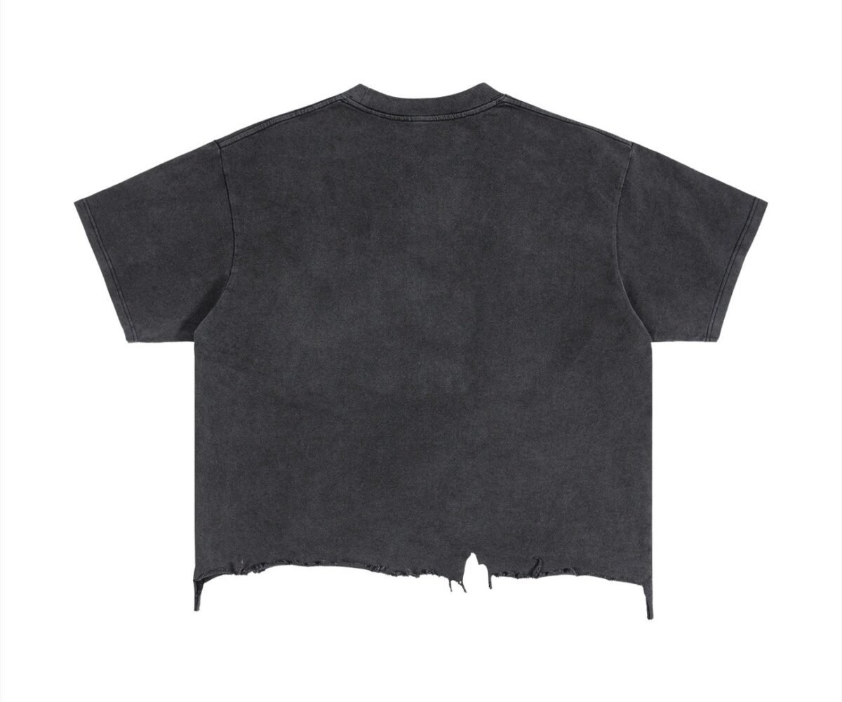 "Peas" back view black colored boxy fit vintage wash t-shirt with distressed hem.