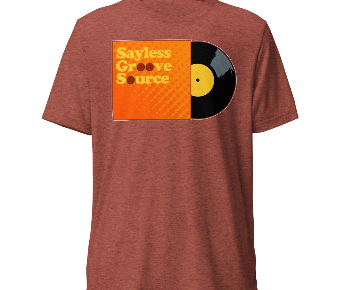"Say Less" front view red clay colored t-shirt with album cover and record graphic.